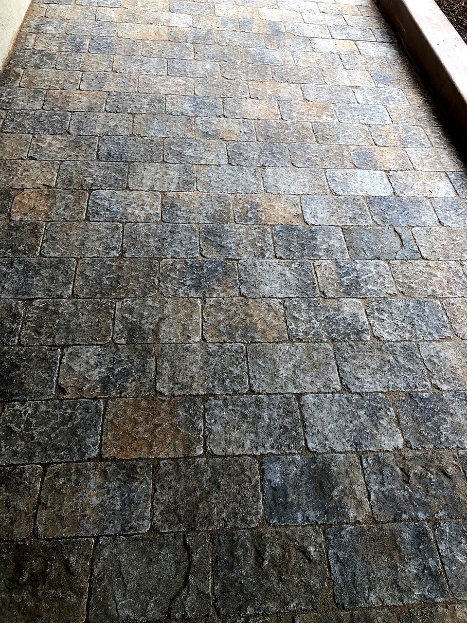 Tumbled paver walkway installed by Capps Construction